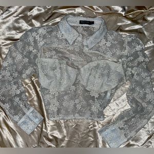 White tool crop top with flower pattern; button collar and open chest